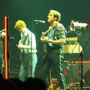 Arcade Fire lost schulden af